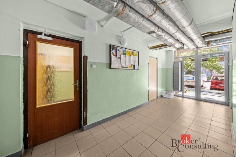 Interior with entrance, tiles, and a sign, suitable for a 3-room apartment.