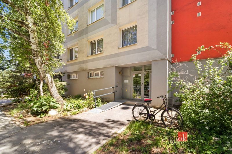 Entrance to the apartment building on E. F. Scherera in Piešťany with a bicycle.