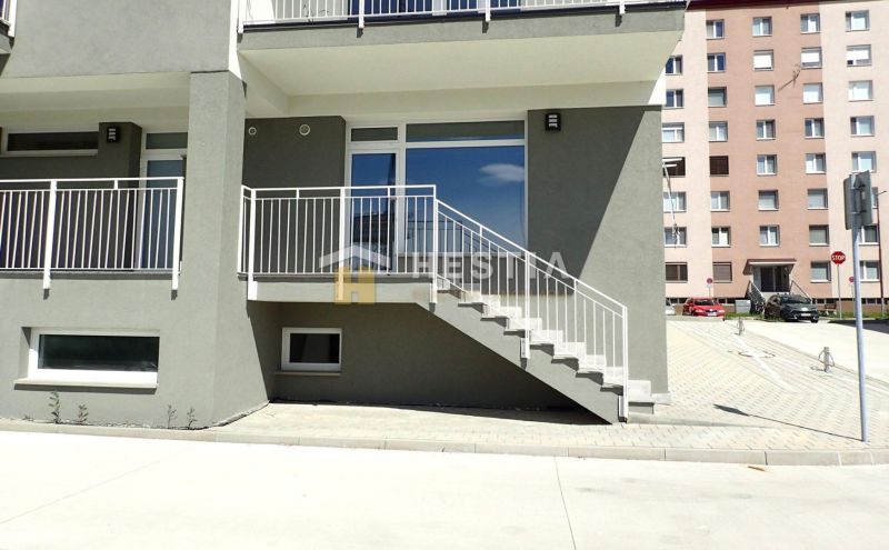 Commercial land in Senica with a staircase and a modern building facade.