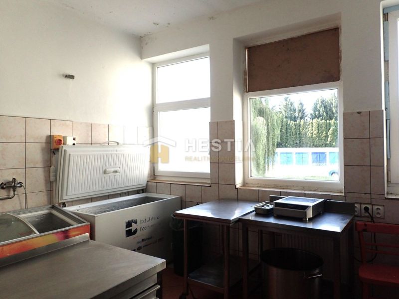 Commercial premises with freezing equipment and stainless steel furniture.