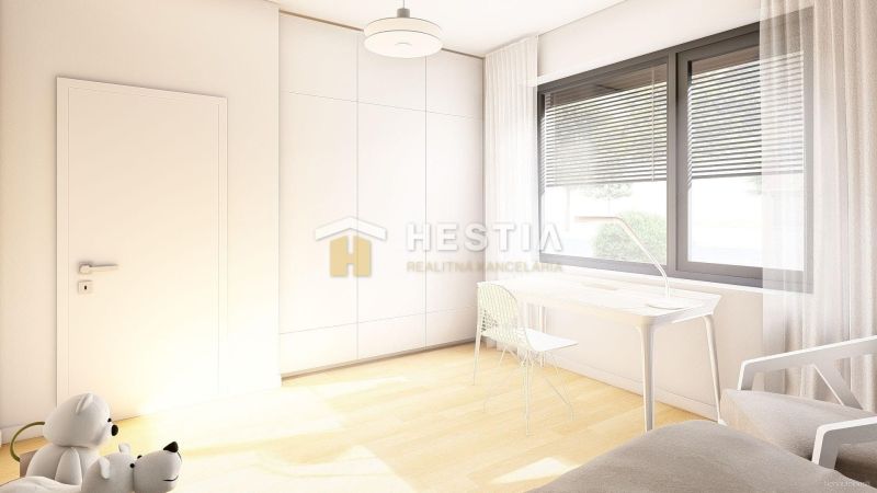 A bright room in a family house with a large window and a wooden decor floor.