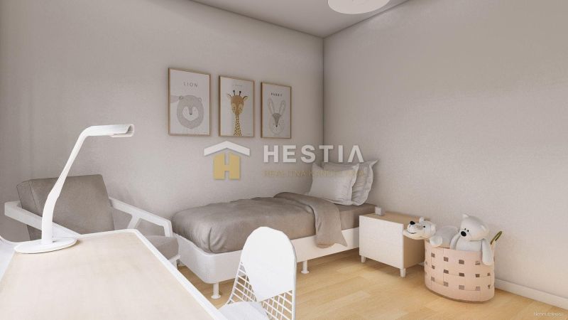 A children's room with a crib, a chair, animal drawings, and a floor with a wooden decor.