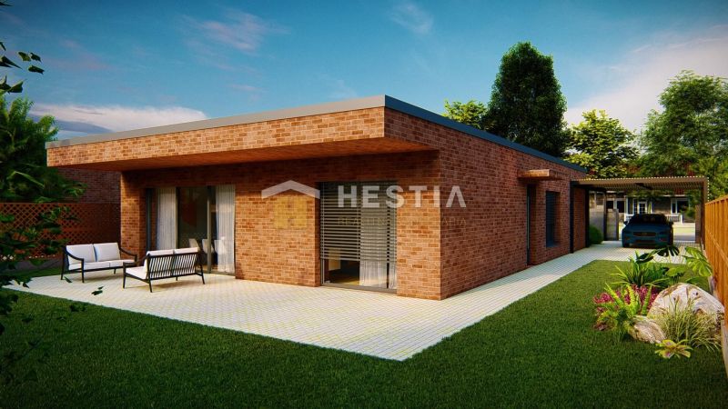 A family house in Hlboké with a terrace, brick facade, and garden seating.