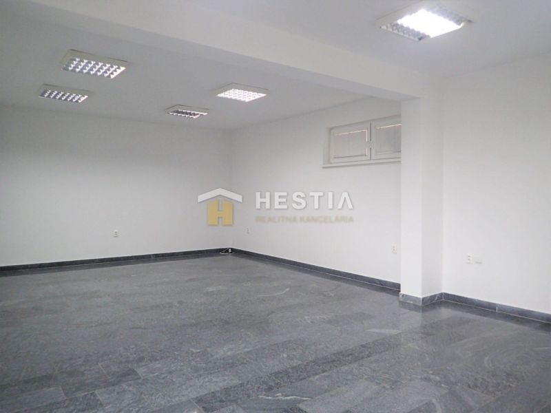 Commercial premises with ceramic flooring and white walls.
