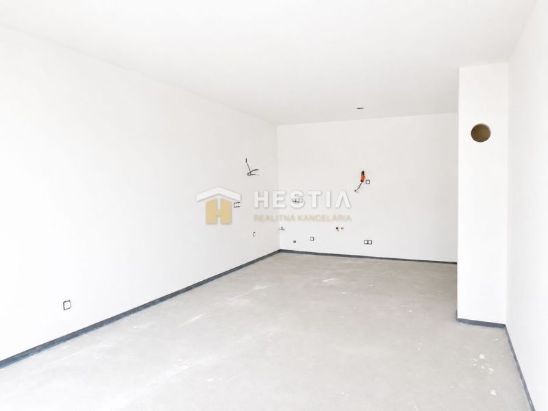 Spacious empty rooms with white walls in a family house.