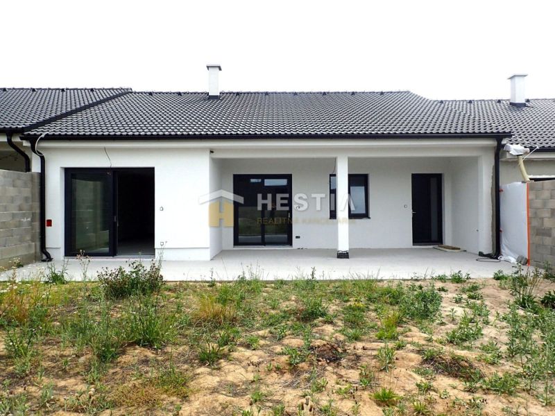 A family house in Hlboké with a terrace, new facade, and a grassed garden.