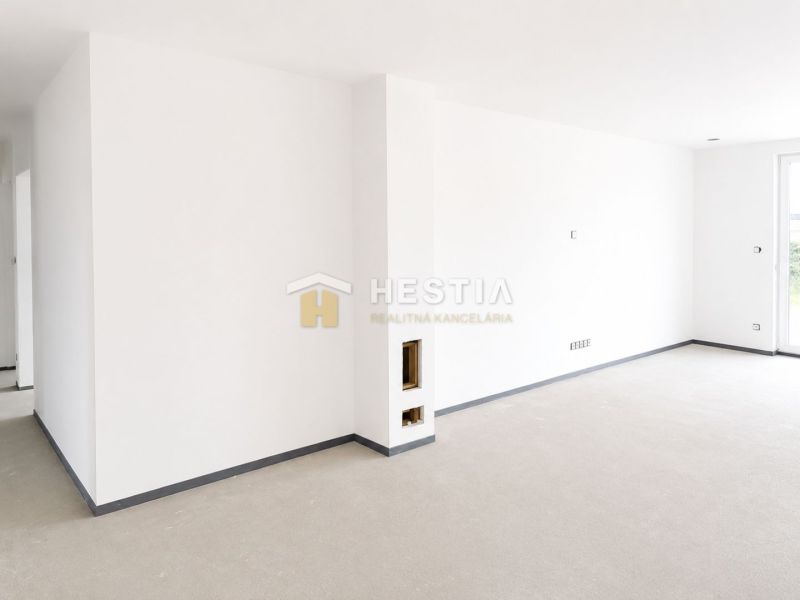 White interior wall in a family house with minimalist flooring and entrance door.