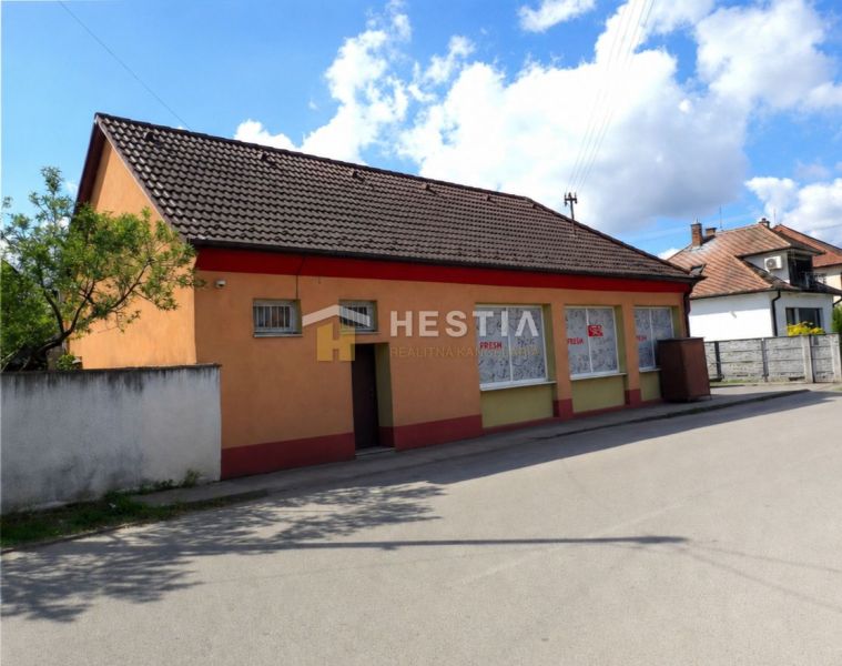 A family house in Borský Mikuláš with an orange facade and a brown roof.