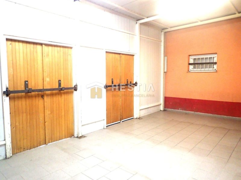 The basement of a family house with brick walls and wooden doors.