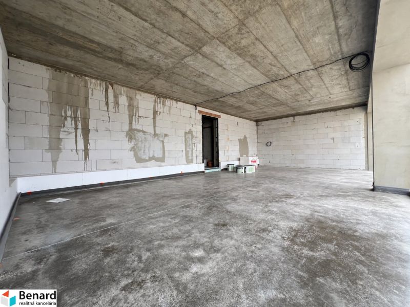 A facility with a concrete ceiling and floor in commercial premises.