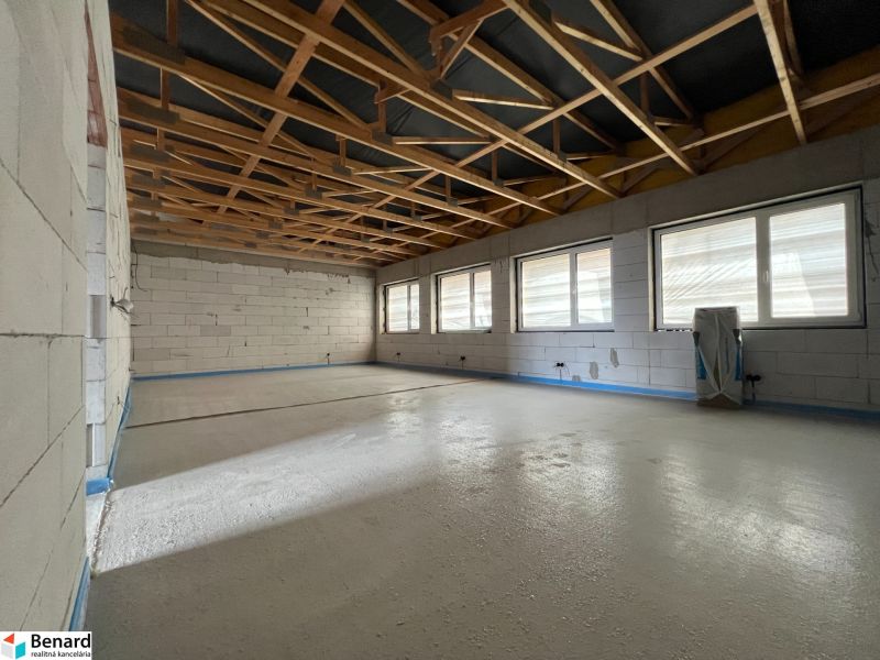 Commercial premises with wooden decor on the floor and large windows, Lipany.
