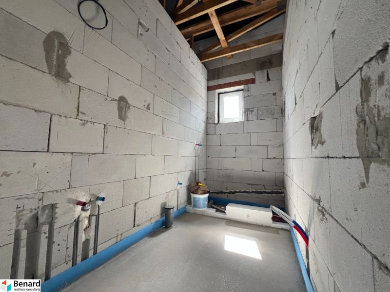 Unfinished commercial spaces with a view of raw walls in Lipany.