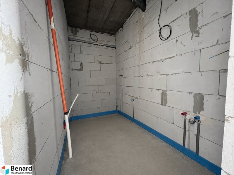 Unallocated commercial spaces with concrete flooring. Future infrastructure for installations.
