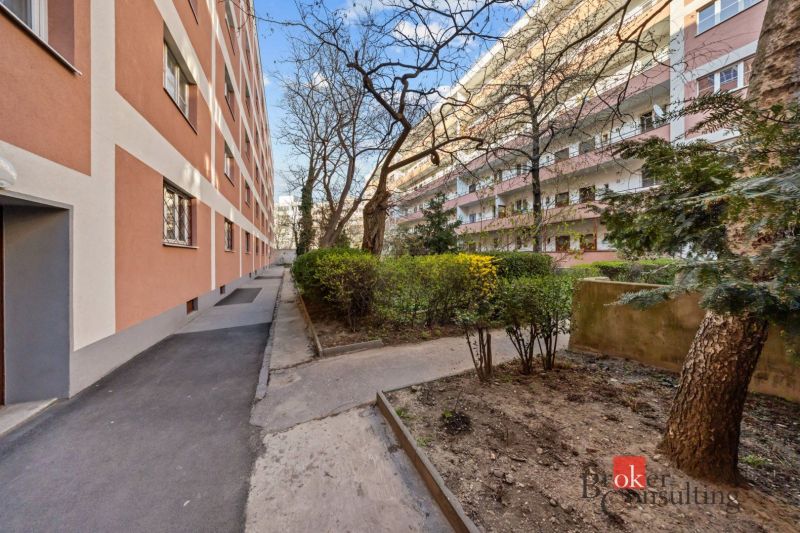 View of the apartment building and garden on Šancová Street in Bratislava-Nové Mesto.