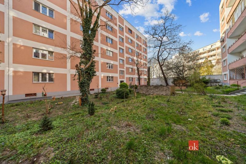 Apartment building with a landscaped green courtyard on Šancová Street in Bratislava-Nové Mesto.