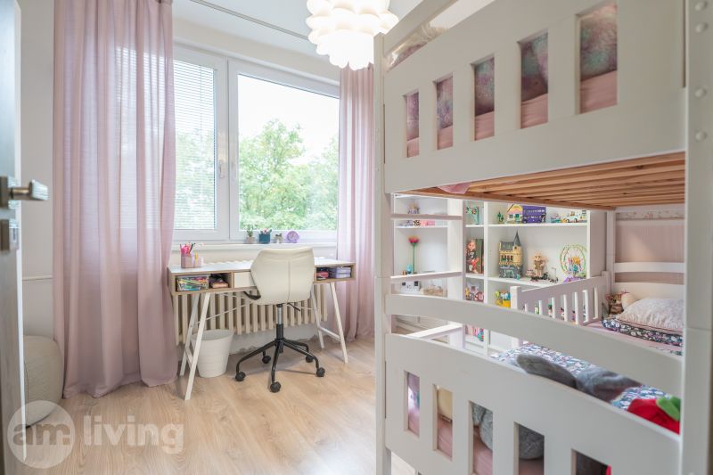 Children's room in a three-room apartment with a bunk bed and a table, floor with wooden decor.