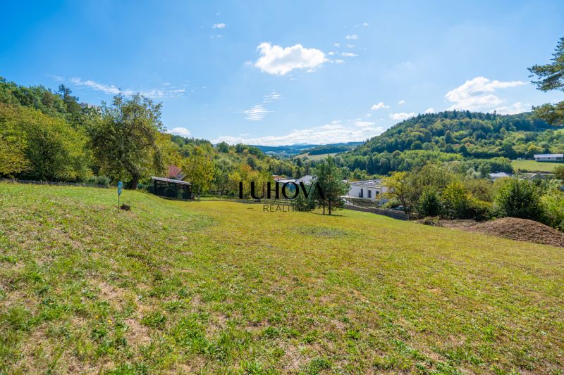 Residential plots in Sládkovičova, Považská Bystrica, surrounded by nature and offering views of the hills.
