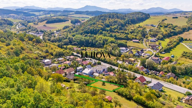 Land in Považská Bystrica on Sládkovičova Street, residential plots, surrounded by greenery.