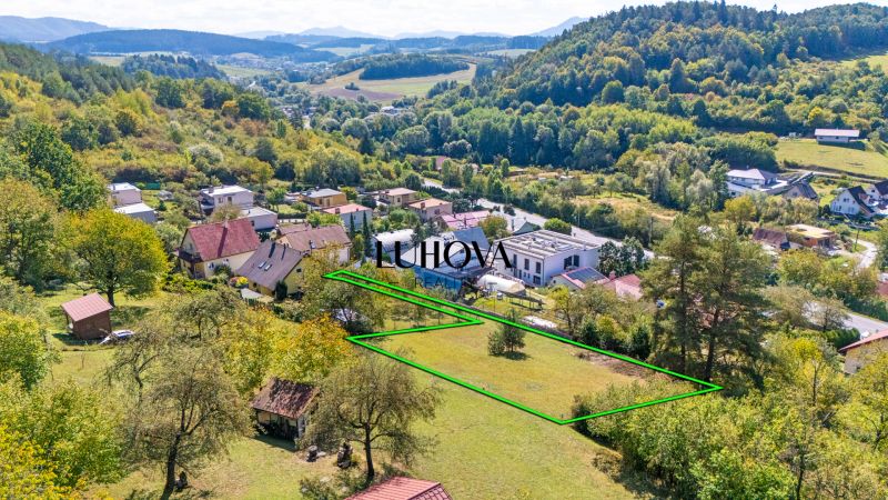 Plots - housing on Sládkovičova Street in Považská Bystrica, surrounded by greenery and houses.