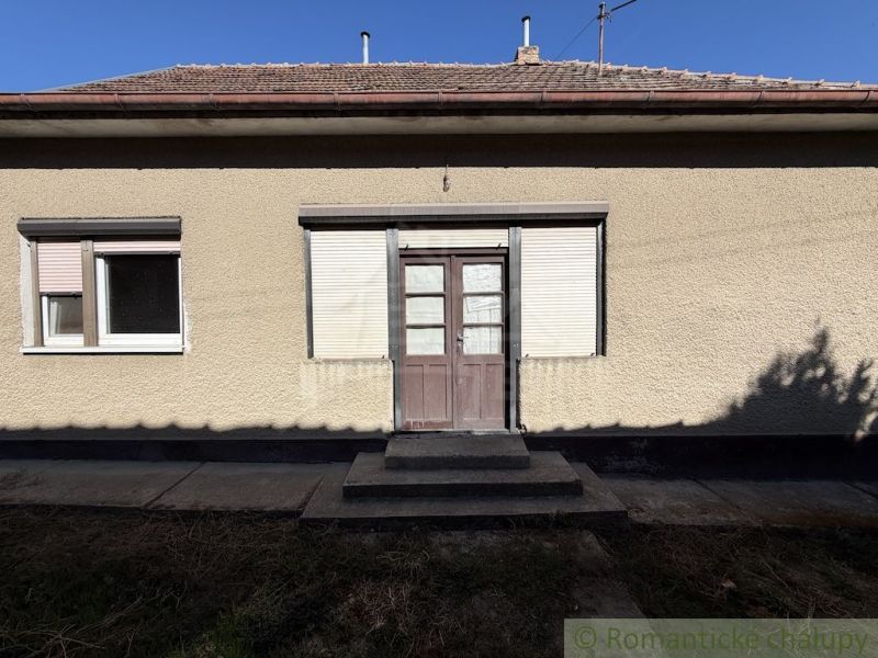 A family house in Tvrdošovce with a simple facade and entrance stairs.