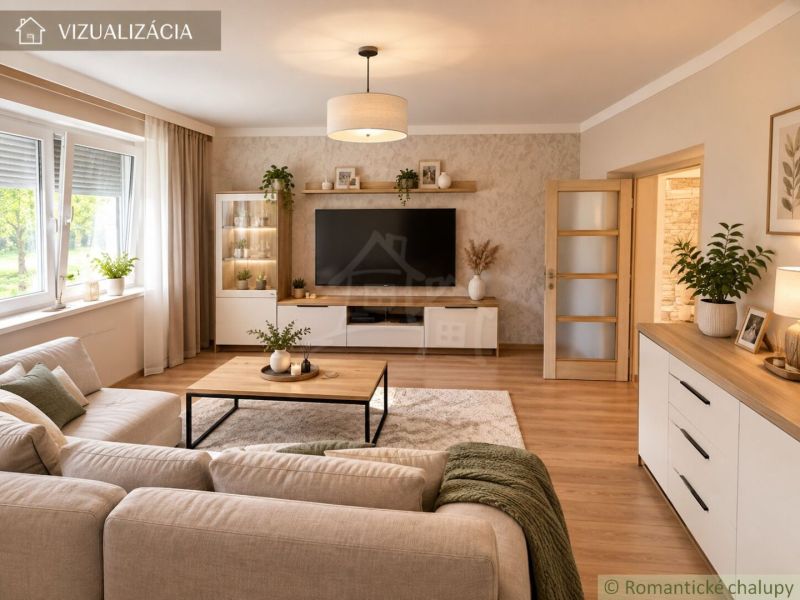 A living room of a family house with a wooden decor floor and a comfortable sofa.