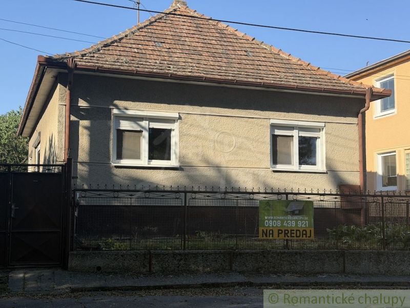 Family house for sale in Tvrdošovce, with a classic roof and a small front garden.
