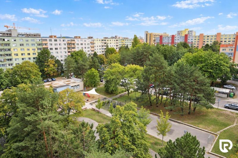 View of greenery and apartment buildings in Bratislava - Dúbravka on Gallayova Street.