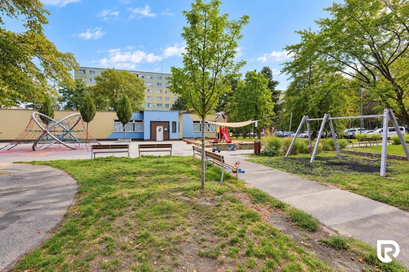 Playground on Gallayova Street in Bratislava-Dúbravka with greenery and swings.