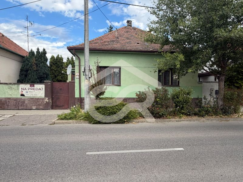 A family house on Šulekova Street in Nové Zámky with surrounding greenery.