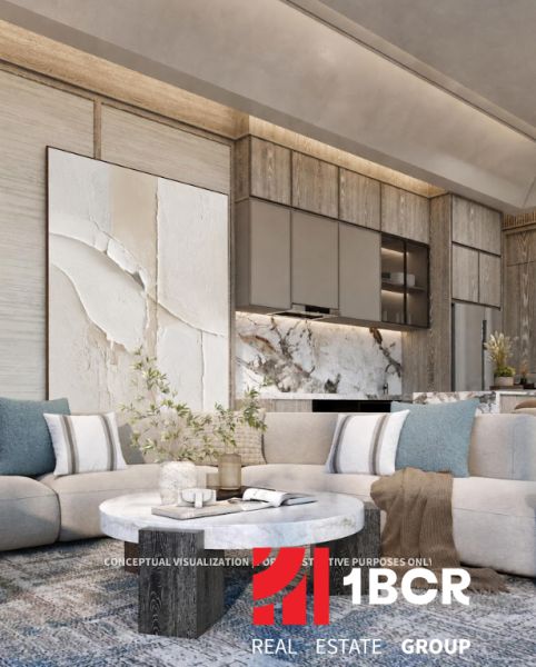 Living room with wood-patterned flooring, a comfortable sofa, and an artistic wall in a 3-room apartment.
