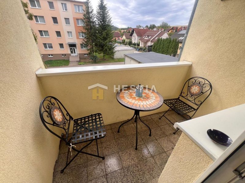A balcony in a 3-room apartment with a view of the streets in Brezová pod Bradlom.
