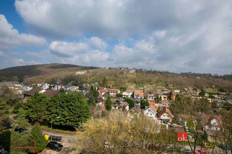 View of the residential area with houses and greenery in Bratislava-Karlova Ves on Donnerova Street.
