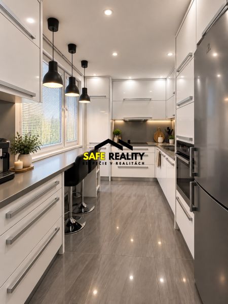 A kitchen in a 3-room apartment with a large window, white cabinets, and bar stools.