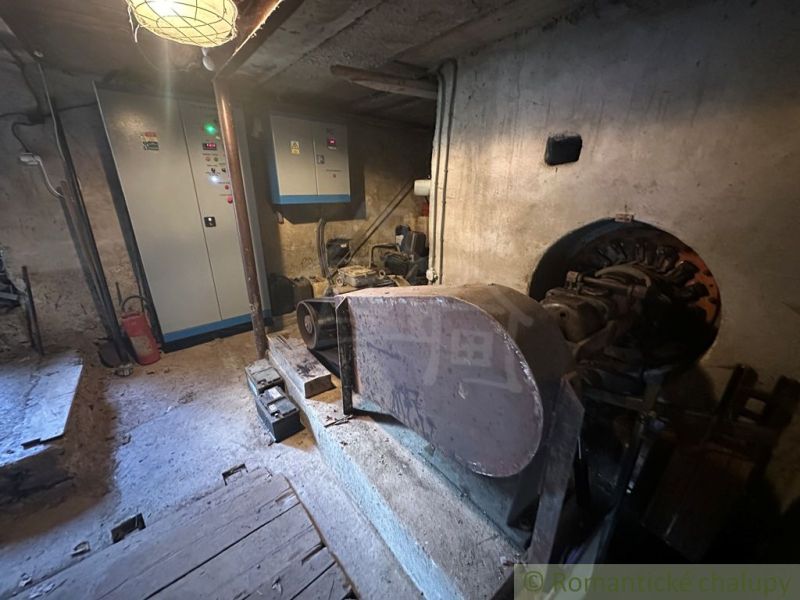 Industrial room in a family house with technical equipment and electrical cabinets.