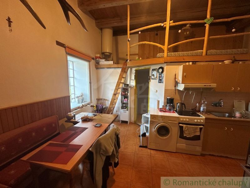 Kitchen with a mezzanine, wooden decor, cozy interior of a family house.