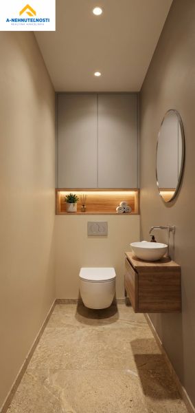 A bathroom in a 3-room apartment with modern equipment and elegant decorative lighting.