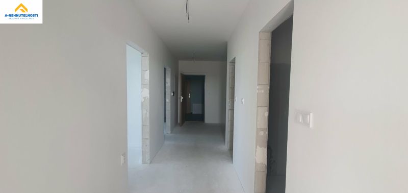 Inside the 3-room apartment, there is a spacious hallway with doors.