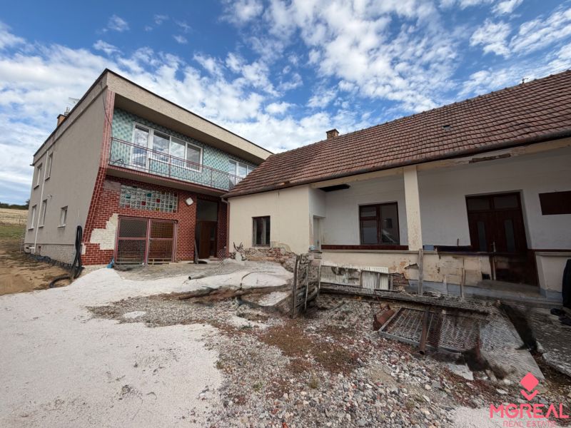 A family house on the main street in Krušovce, with a garage and an outdoor terrace.