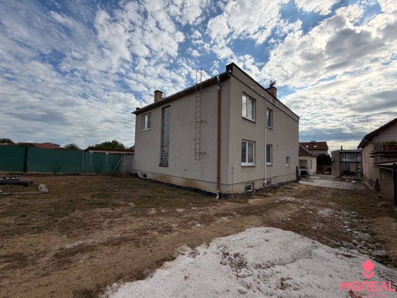 A family house on the main street in Krušovce with a large yard and a concrete area.