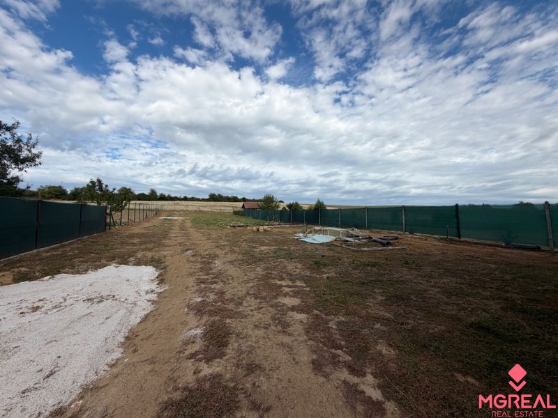 Building plot in Krušovce with a fence on the main street, ready for the construction of a family house.