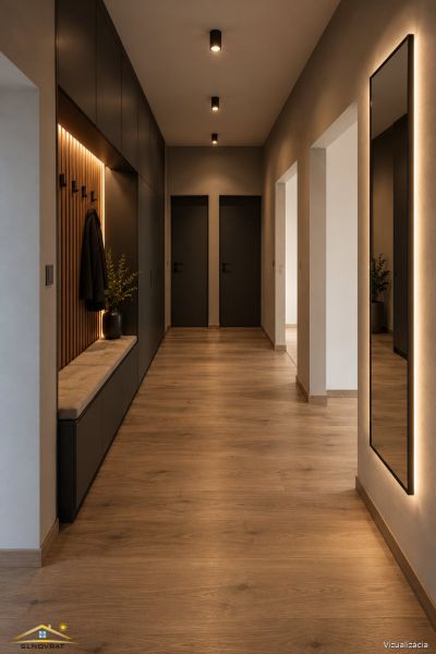 The hallway in a 3-room apartment with a wooden decor floor, black doors, and lighting.