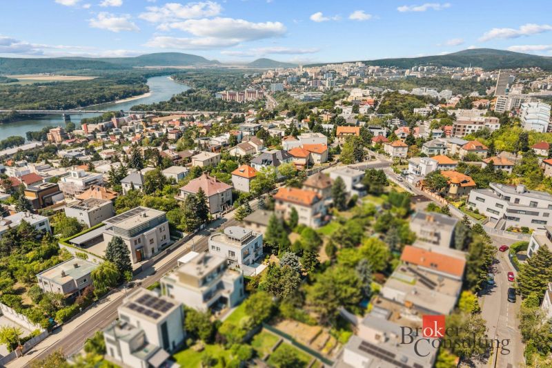 Aerial view of villas in Bratislava-Old Town with the Danube River in the background.