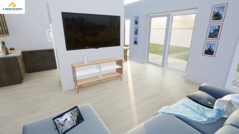 Living room in a family house with wood-patterned flooring and large windows.