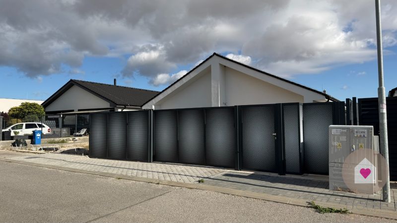 A family house on Cífer Street in Trnava with a modern fence and gate.