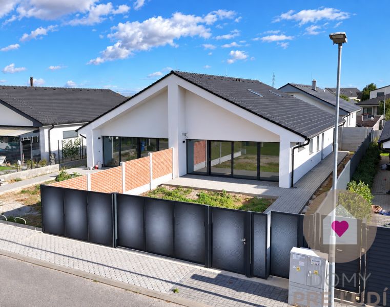 A family house on Cífer Street in Trnava with large windows and a garden behind the fence.