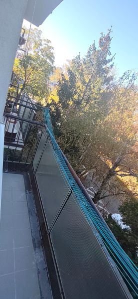 A balcony with a view of greenery from Sečovská Street, Bratislava - Ružinov, 3-room apartment.