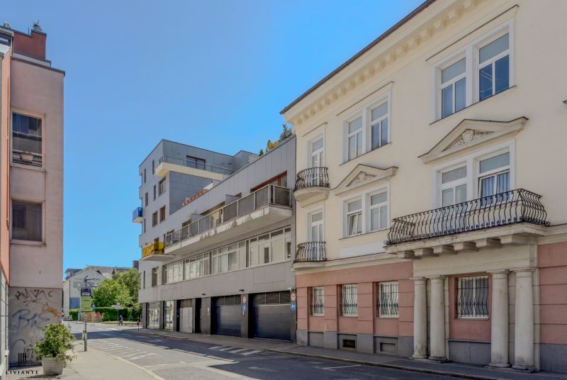 Buildings on Dunajská Street in Bratislava - Old Town under a blue sky.