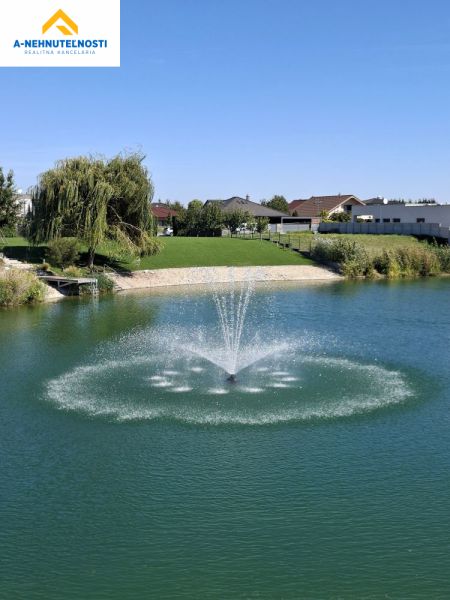 Fountain on a lake surrounded by greenery, Hrubá Borša, Golf, 2-room apartment.