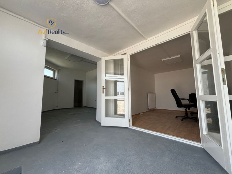 Interior with folding doors, office chair, and wooden decor flooring, warehouses and halls.