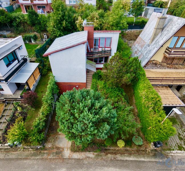 A cottage on Rekreačná Street in Vrbové surrounded by a garden and greenery.